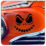 Black skull applied to the bodywork of a classic red car