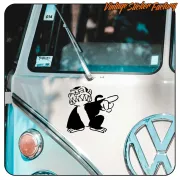 Detail of the Evil Monkey applied beside the emblem of a classic van