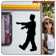 Large Frankenstein silhouette applied to the side of a caravan, next to a person