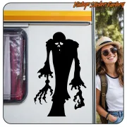 Silhouette noire d’une créature monstrueuse appliquée sur la porte d’une caravane
