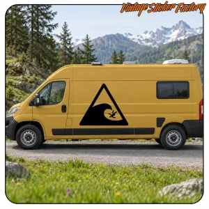 Yellow van with a large triangular warning sticker for surfers