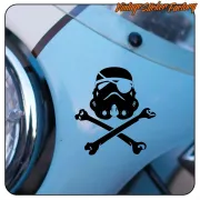 Black Stormtrooper design with crossed keys applied next to the headlight of a blue vehicle