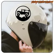 Circular adhesive with off-road vehicle silhouette placed on a white motorcycle helmet