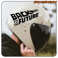 Close-up of a light-coloured helmet with the black “Back to the Future” sticker