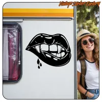 Application of the lips-with-fangs design on a caravan beside a female traveller