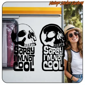 Two skull and “Sorry I'm not cool” stickers placed on a door