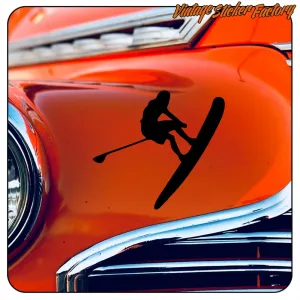 Black paddleboarding silhouette applied to the orange bodywork of a classic car