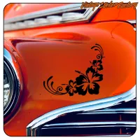 Black Hibiscus sticker on the orange bodywork of a classic car