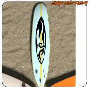 Black and yellow design applied lengthwise to a surfboard