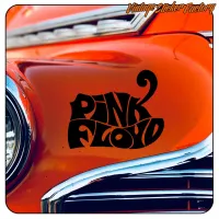 Diseño Pink Floyd aplicado sobre la carrocería naranja de un vehículo clásico, vista alternativa