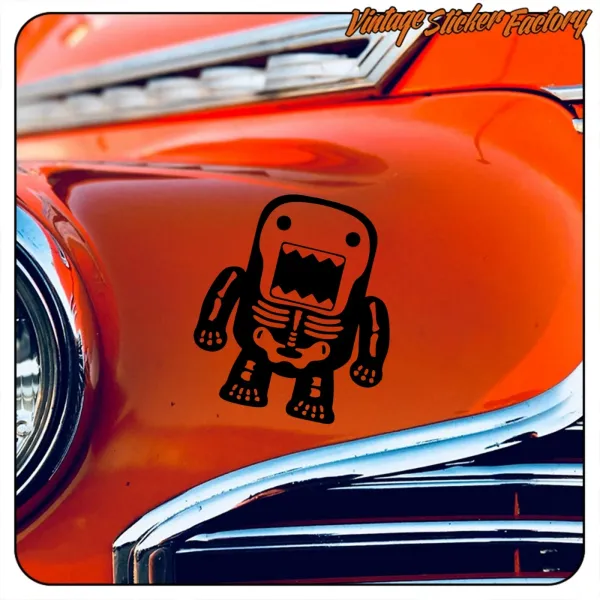 Close-up of Domo-kun Skeleton applied to the orange bodywork of a classic car