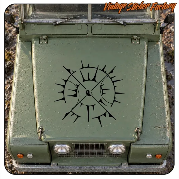 Black compass rose placed on the front of a green vehicle