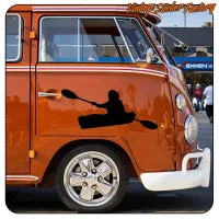 Detail of a kayaker silhouette applied to an orange van