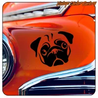 Black pug design applied to the orange bodywork of a classic car
