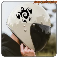 White motorbike helmet with black tribal turtle design and dark visor