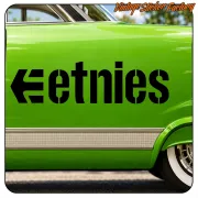 Black etnies logo applied to the side of a green vehicle