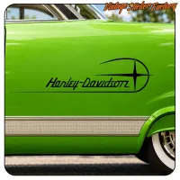Detail of the Harley-Davidson design on the green bodywork of a classic car