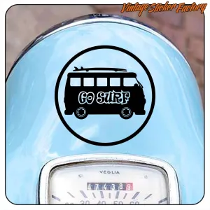 Circular «Go Surf» sticker placed on the blue bodywork of a classic vehicle.