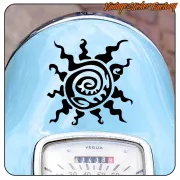 Black tribal sun sticker on the blue bodywork of a scooter