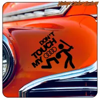Black «DON’T TOUCH MY AUDI» design applied to the bodywork of a classic orange vehicle