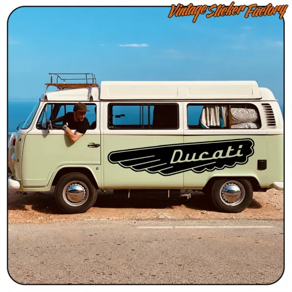 Large black Ducati sticker applied to the side of a camper van