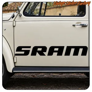 Black SRAM sticker applied to the door of a light-coloured off-road vehicle