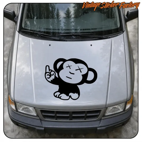 Front view of a silver car with the monkey design applied to the bonnet
