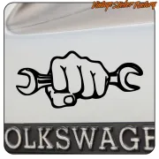 Fist holding two spanners design on the rear of a Volkswagen