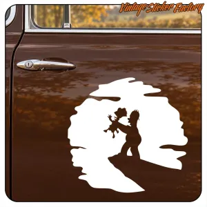 White silhouette with two figures applied to the door of a classic car