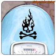 Black flaming skull with crossed bones on the blue front of a motorbike