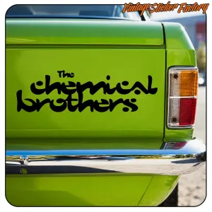 Black «The Chemical Brothers» text applied to the rear of a green vehicle