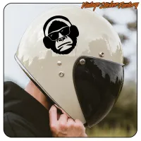 Gorilla-Aufkleber mit Brille und Kopfhörern auf einem Motorradhelm, Seitenansicht