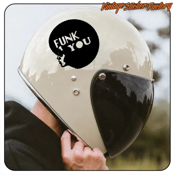 FUNK YOU sticker applied to a motorcycle helmet with dark visor