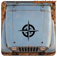 Black compass rose applied to the bonnet of a vintage vehicle