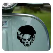 Bride of Frankenstein's face applied to a vehicle body