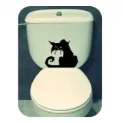 Black cat silhouette placed on the cistern of a toilet