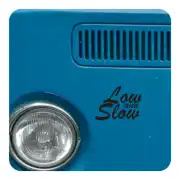 «Low and Slow» adhesive applied next to the headlight of a blue vehicle