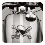 Skull with bandana and spanners applied to a motorcycle fuel tank