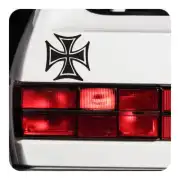 Black Maltese Cross applied beside the rear light of a vehicle