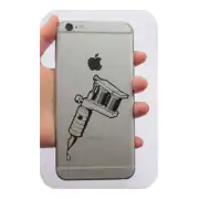 Black tattoo machine applied to the back of a mobile phone