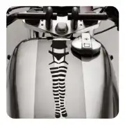 Black pin-up legs design applied lengthwise to a motorbike fuel tank