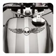 Skull with wings applied to the fuel tank of a motorcycle