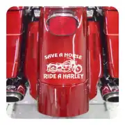 White decal with motorcycle and «SAVE A HORSE RIDE A HARLEY» text on a red motorcycle