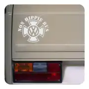 White “NON HIPPIE BUS” sticker applied to the rear of a van