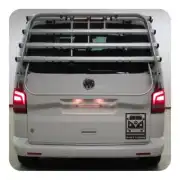 FREECAMPING sticker placed on the rear door of a van