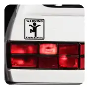 WARNING KNOWS KUNG FU sticker applied to the white rear of a vehicle