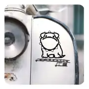 Puppy sticker applied to the front of a vintage vehicle