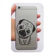 Black-and-white dog sticker placed on the back of a phone
