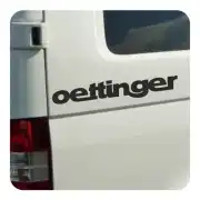 OETTINGER vinyl applied to the white rear side of a vehicle