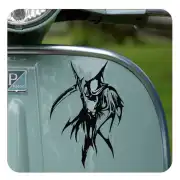 Scythe with hooded figure applied to the side of a vehicle